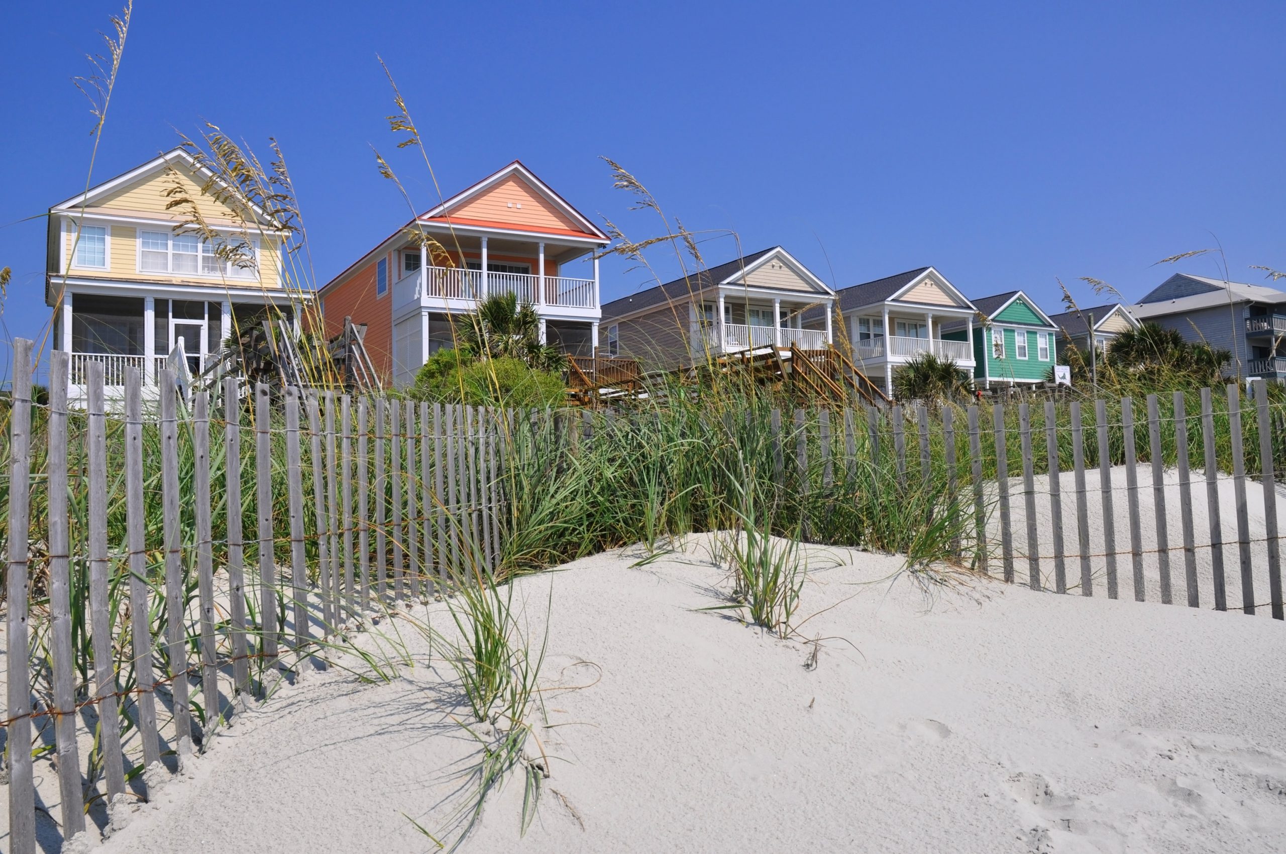 beach homes behind beach dunes