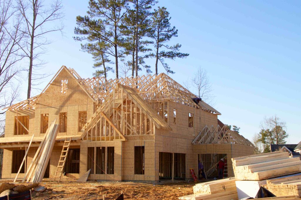 a house under construction with wooden framing