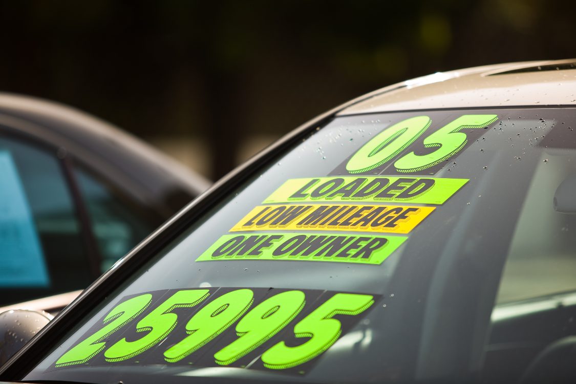 used-car-shopping Car with price and mileage information on it