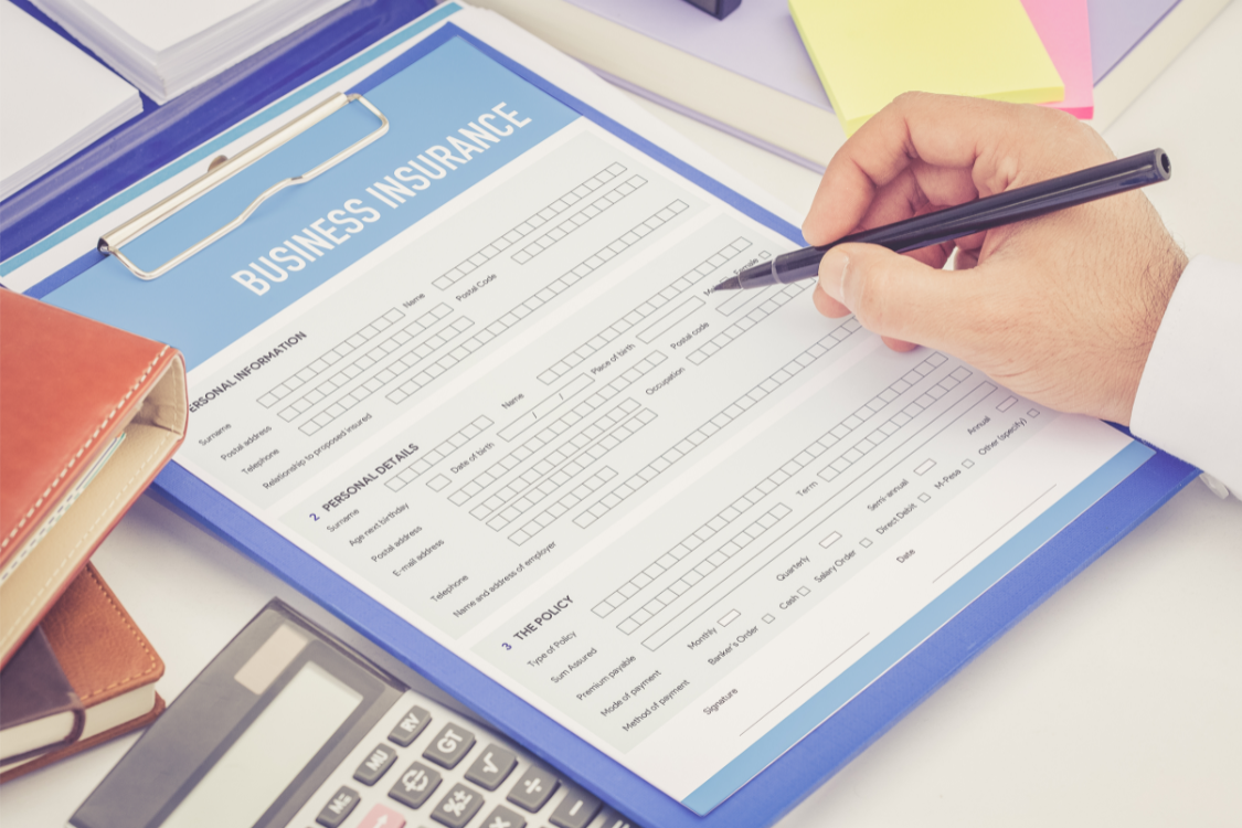HVAC business insurance Person with a pen walking through a business insurance form