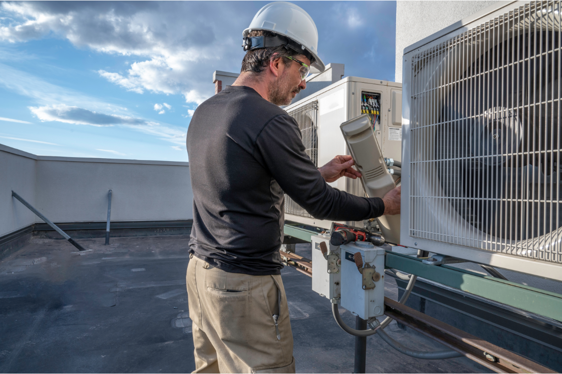 HVAC-technician HVAC technician working on HVAC