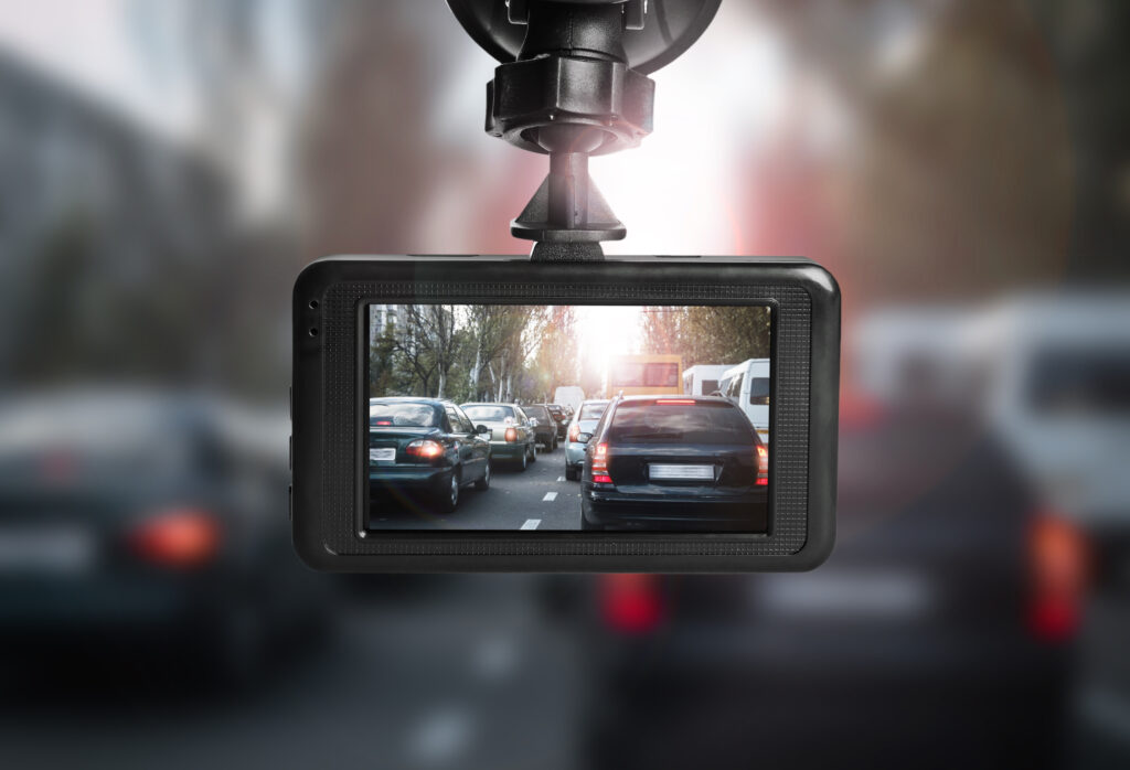 a car's rear view mirror with a camera attached to it