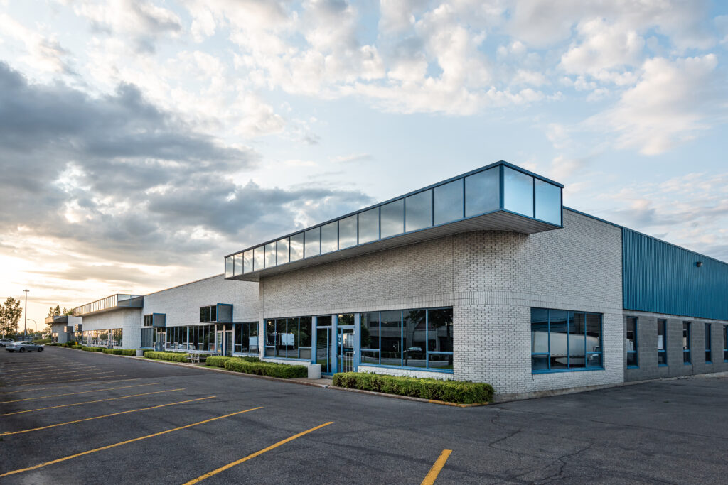an empty parking lot in front of a building